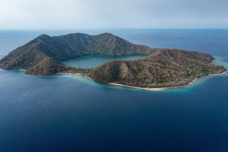 Aerial view of Satonda Island and its crater lake, Moyo Satonda National Park